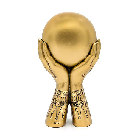 altseende øje statue i guldfarve