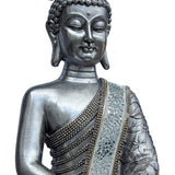 buddha statue i sølv nuancer tæt på