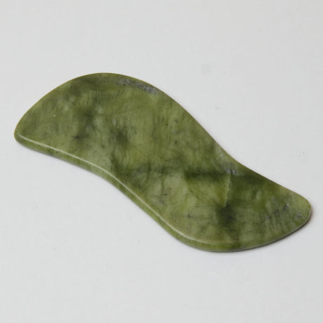 grøn gua sha jade redskab med spil
