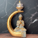 buddha på stødtand statue i gyldne nuancer