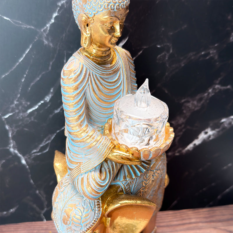 buddha på elefant fyrfadsholder statue tæt på det medfølgende lys
