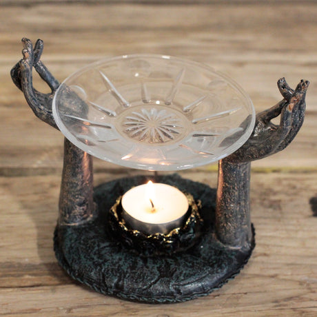 divine hands diffuser med hænder der holder en glasskål