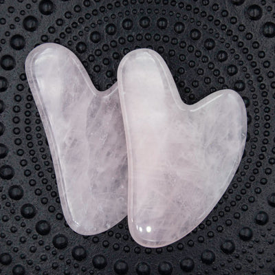 rosakvarts gua sha massage sten 5